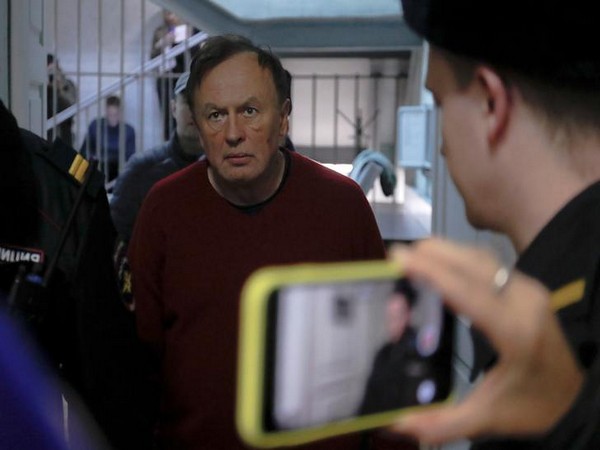 Russian historian Oleg Sokolov escorted before a court hearing in Saint Petersburg 