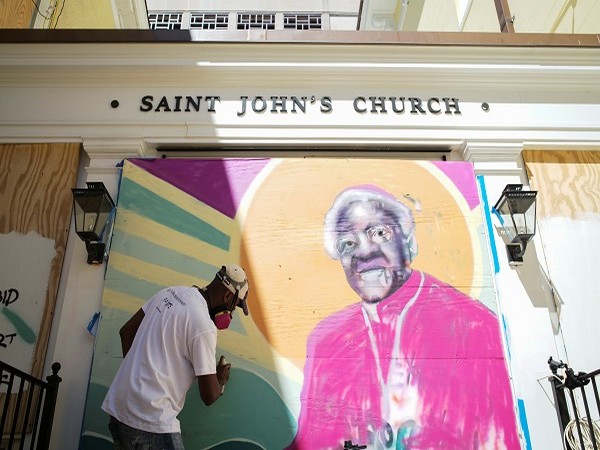 A mural of Desmond Tutu on the boarded-up windows of St. John's Church as a work of art activism for racial justice at Black Lives Matter Plaza in Washington. (PC: Reuters)