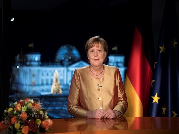 German Chancellor Angela Merkel poses for photographs after the television recording of her annual New Year's speech at the chancellery in Berlin, Germany. (Photo Credit: Reuters) 