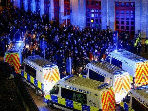Demonstrators gather outside a police station during a protest against a new proposed policing bill, in Bristol, Britain, March 21, 2021. (Photo Credit: Reuters) 