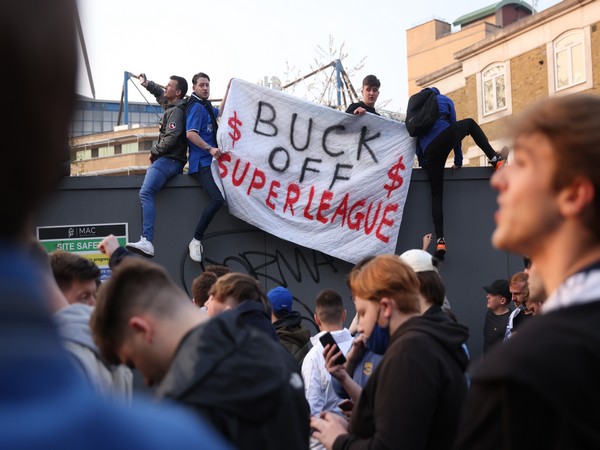 Chelsea fans hold a banner outside the stadium before the match after reports suggest they are set to pull out of the European Super League. (Image Courtesy: Reuters)