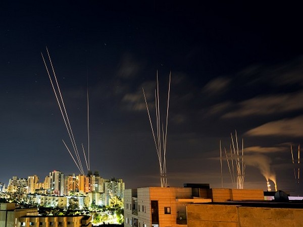 Streaks of light are seen as rockets are launched from the Gaza Strip towards central Israel as seen from Ashkelon, Israel May 16. (Photo Credit: Reuters)