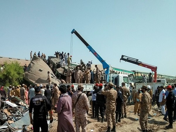 Paramilitary personnel and rescue workers gather at the site following a collision between two trains in Ghotki, Pakistan June 7, 2021. (Photo credit: REUTERS)