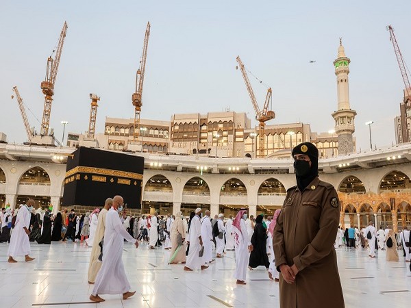 A Saudi police female officer stands guard as pilgrims perform final Tawaf during the annual Haj pilgrimage, in the holy city of Mecca, Saudi Arabia July 20, 2021. (Photo Credit: REUTERS)