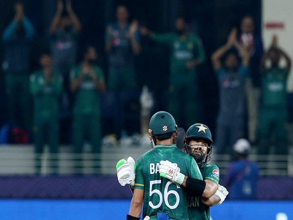 Pakistan's Mohammad Rizwan celebrates reaching his half century with Babar Azam 