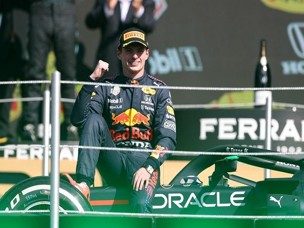 Max Verstappen on podium after winning Mexico City GP.