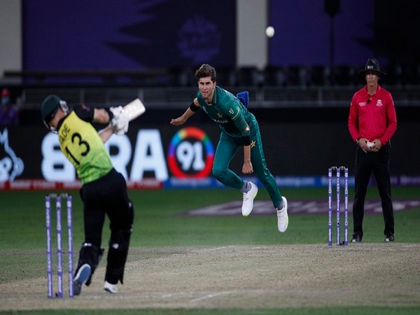 Pakistan's Shaheen Shah Afridi bowls as Australia's Matthew Wade hits the ball
