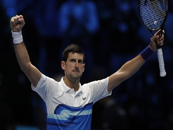 Novak Djokovic celebrates winning his group stage match against Andrey Rublev 