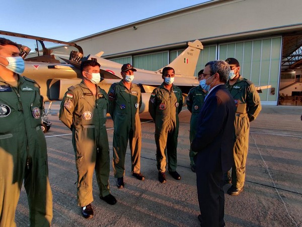 Indian ambassador to France interacts with pilots of Rafale jets with tail no RB-005 in the background