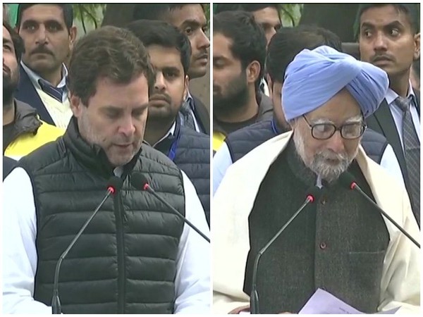 Congress leaders Rahul Gandhi and Manmohan Singh read Preamble of Constitution during a protest against CAA and NRC at Rajghat in New Delhi on Monday. Photo/ANI