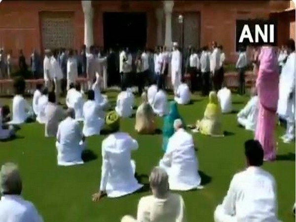 Congress MLAs supporting CM Ashok Gehlot raise slogans at Raj Bhawan in Jaipur. (Photo/ANI)