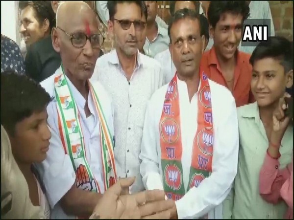 Congress worker, Bapu Lal Sen shaves his head  in Rajgarh on Saturday after losing a bet