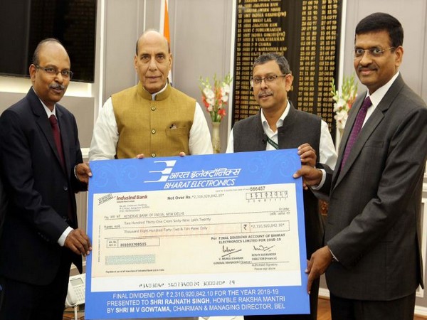 Defence Minister Rajnath Singh receiving the cheque from Chairman and MD of BEL MV Gowtama on Thursday in New Delhi. Photo/ANI