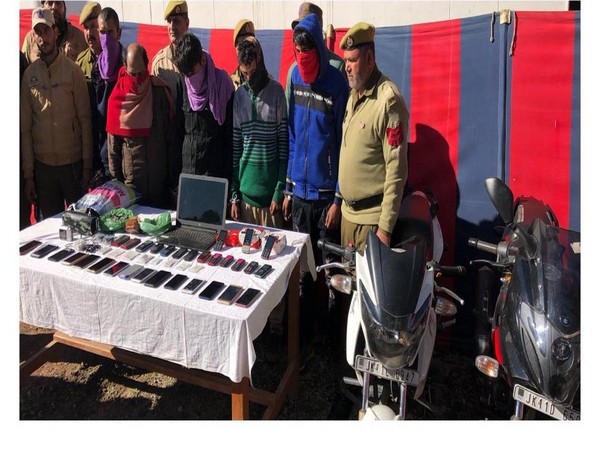 Jammu and Kashmir Police team with the thieves and recovered property in Rajouri. Photo/Twitter