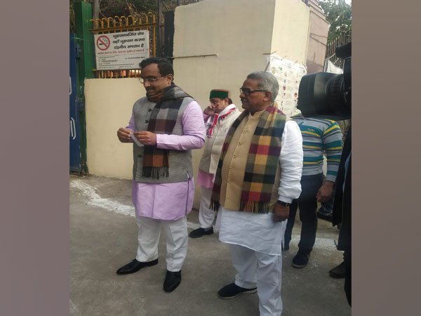 RSS joint general secretary Krishna Gopal and BJP's senior leader Ram Madhav at polling station in Jhandewalan on Saturday morning.