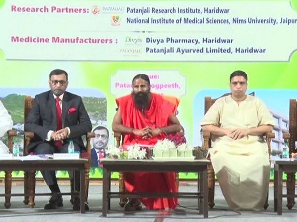 Ramdev speaking at the launch of Patanjali's Ayurvedic medicine for COVID-19 in Haridwar on Tuesday. [Photo/ANI]