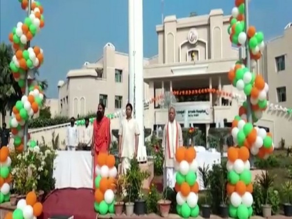 Yoga guru Ramdev hoisted national flag on the occasion of Independence Day in Haridwar on Saturday. (Photo/ANI)