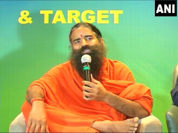 Yoga guru Baba Ramdev speaking at an event in Indore on Monday.