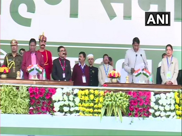 Congress' Rameshwar Oraon taking oath as Cabinet Minister of Jharkhand in Ranchi on Sunday. Photo/ANI