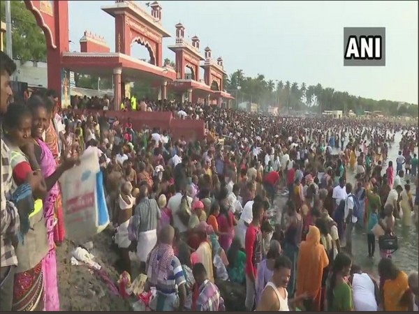 Devotees take a holy dip on 'aadi amavasya' in Rameshwaram on Wednesday. Photo/ANI