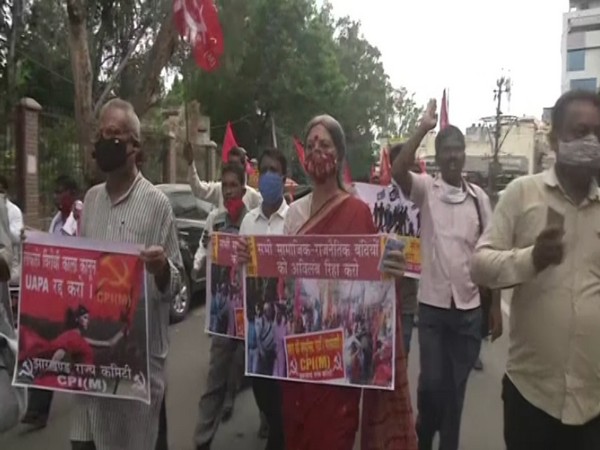 Left parties stage protests and sit-in dharna outside Ranchi Rajbhawan against the death of Stan Swamy. (Photo/ANI)