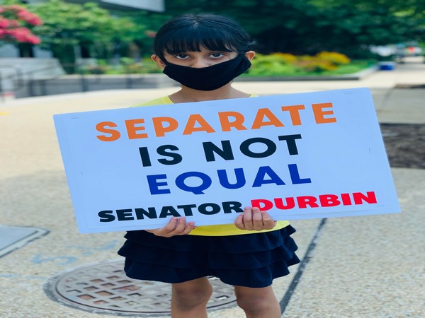 One of the protestors holding a banner during the Equality Rally in Washington DC. Photo/ANI
