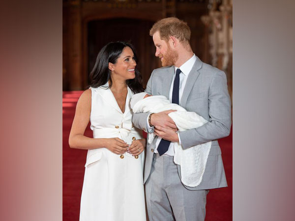 Prince Harry and Meghan Markle with their new born son 
