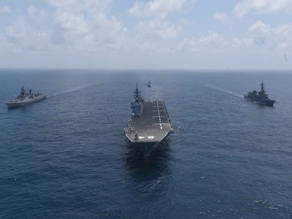 Indian Navy and Japanese Maritime Self-Defense Force (JMSDF) ships conducting operations in close formation at JIMEX-2020.