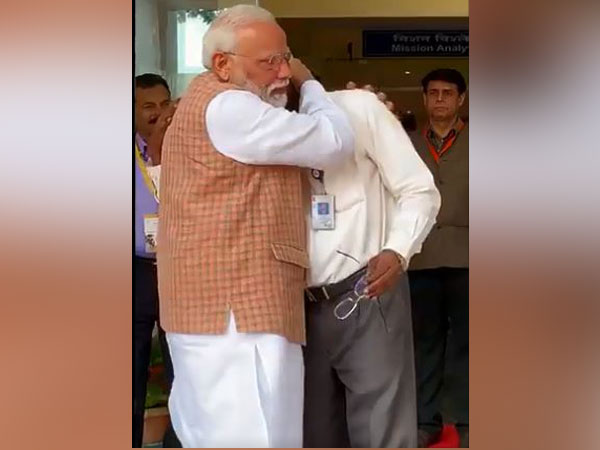 PM Modi consoles ISRO Chairman K Sivan as he breaks down. Photo/ANI