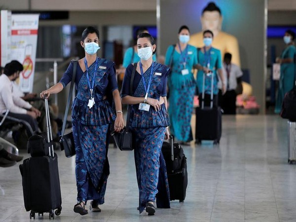 Sri Lankan Airlines staff wear masks at Bandaranaike International Airport