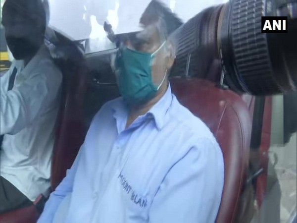 A visual of the apartment watchman being brought to the guest house in Mumbai on Wednesday. Photo/ANI