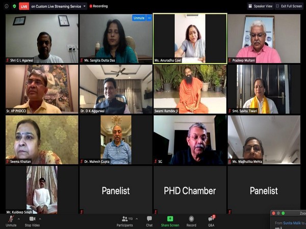 PHDCCI members with Yoga Guru Swami Ramdev during a virtual session on International Yoga Day.
