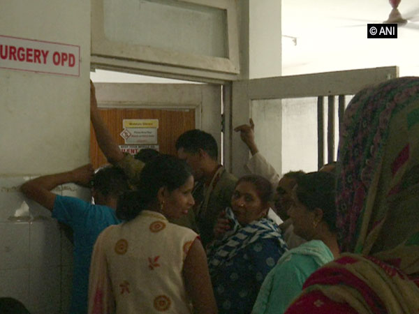 Patients standing in a queue at Samba district hospital. [Photo/ANI]