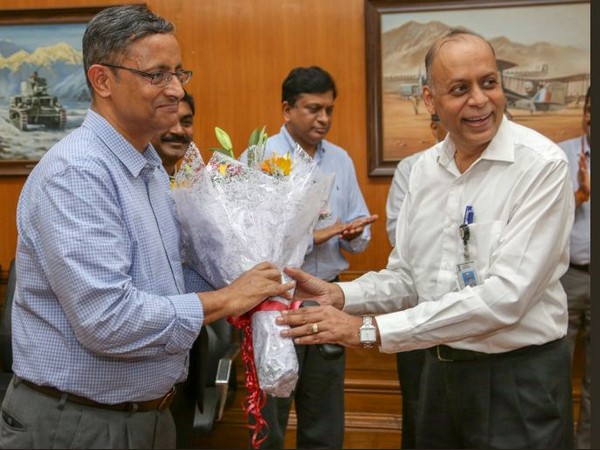 Defence Secretary Ajay Kumar felicitates outgoing Sanjay Mitra on his retirement function. Photo/Twitter