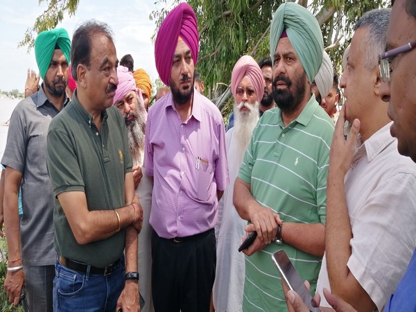 Punjab Water Resources Minister Sukhbinder Singh Sarkaria (3rd from left),  inspecting the flood-like situation in Ropar, Phillaur. Photo/ANI 