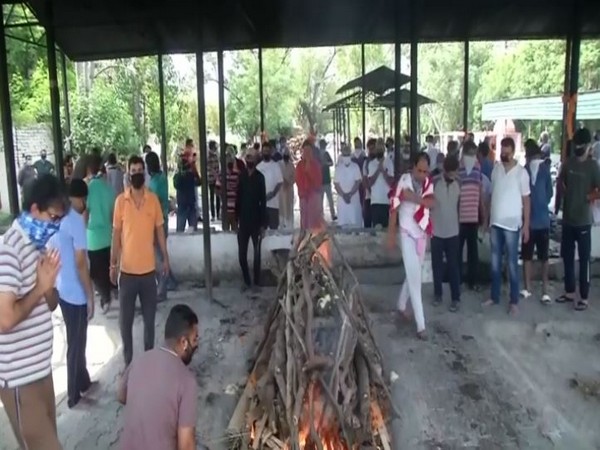 Cremation of Ajay Pandita being performed in Jammu. (Photo/ANI)