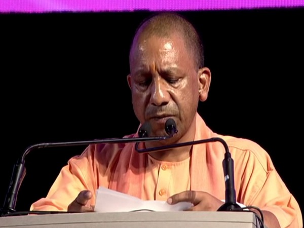 Uttar Pradesh Chief Minister Yogi Adityanath addresses at the UP Investors Summit in Lucknow on Friday. (Photo/ANI)