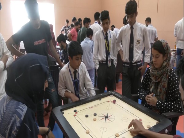 Participants playing carrom at the District Carrom Championship held in Srinagar