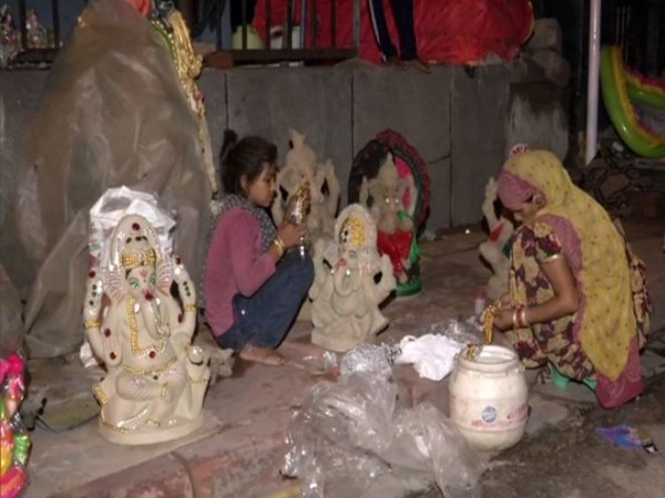 Sculptors in Delhi are making handmade Ganesh idols ahead of Ganesh Chaturthi. (Photo/ANI)
