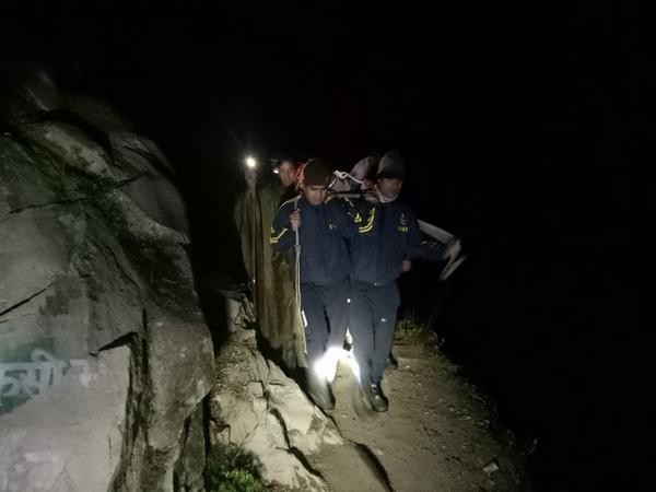 The SDRF team bringing the tourist to Gangotri. (Photo/ANI)