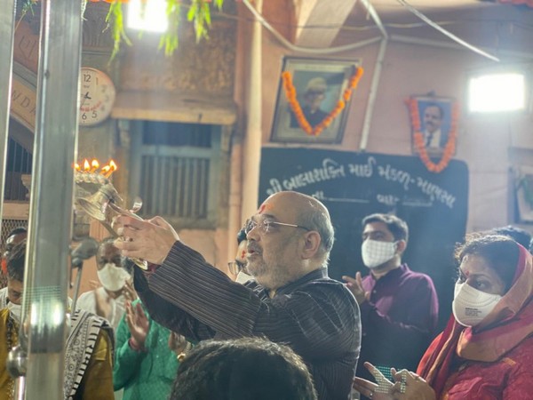 Union Home Minister Amit Shah at the temple in Gandhinagar on Saturday. photo/Twitter (Amit Shah)