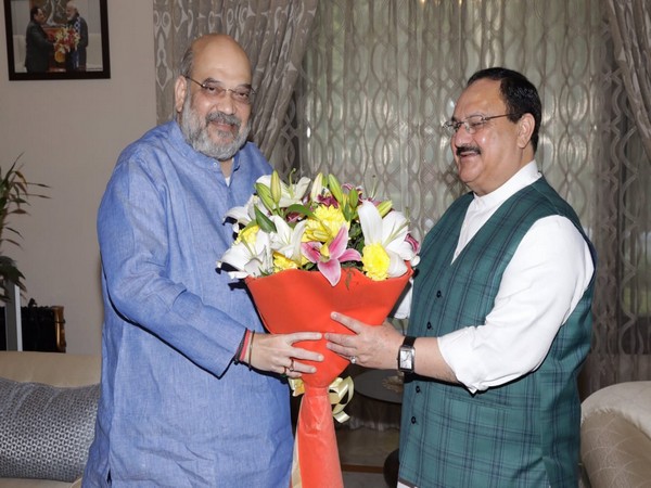 Union Home Minister Amit Shah congratulating BJP President JP Nadda at his residence in New Delhi on Wednesday. (Picture: Shah's Twitter)