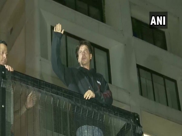 Shah Rukh Khan waves at fans who gathered outside his residence, 'Mannat' on his 54th birthday