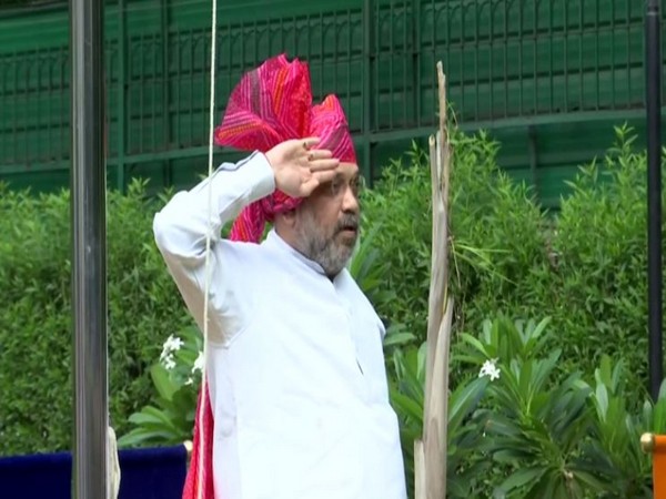 Union Home Minister Amit Shah hoisted the flag at his residence in New Delhi on Saturday. Photo/ANI