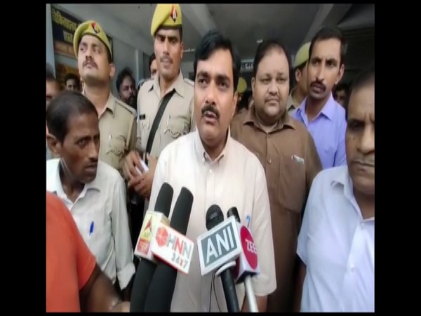 Shahjahanpur District Magistrate Indra Vikram Singh talking to reporters on Tuesday.