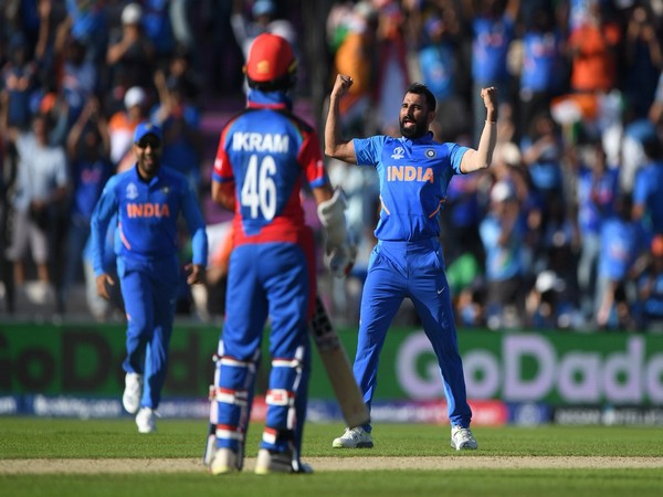 Indian pacer Mohammad Shami celebrating after taking wicket