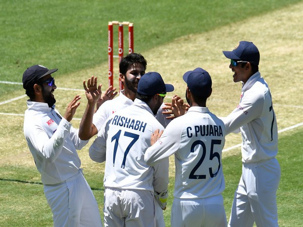 Indian players celebrating at the Gabba after taking a wicket against Australia (Photo/ BCCI Twitter) 