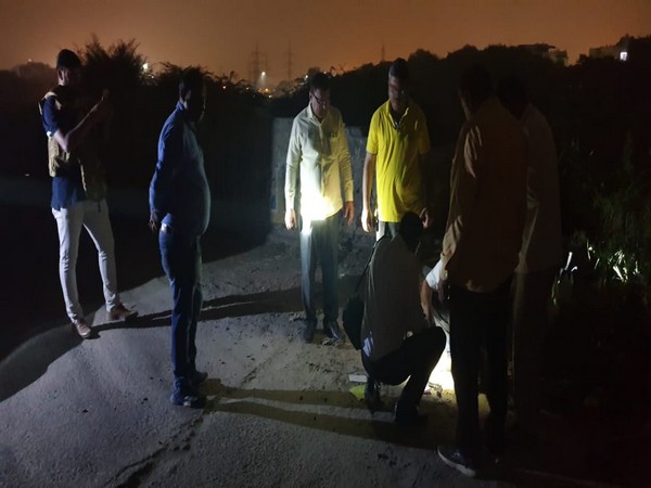 Delhi Police team conducting investigation at the shoot out location in Rohini