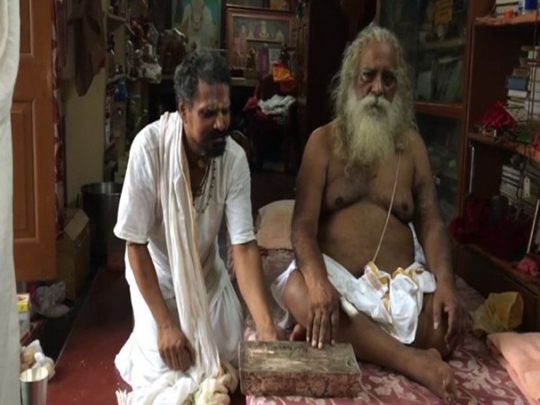 Mahant Nritya Gopal Das, president, Ram Janambhoomi Teerth Kshetra Trust with the about 40 kg silver brick. Photo/ANI