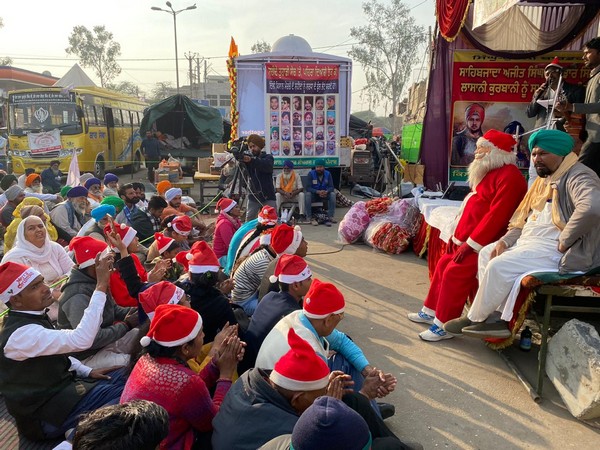 Church volunteers from Delhi celebrate Christmas with protesting farmers at Singhu border. (Photo ANI)